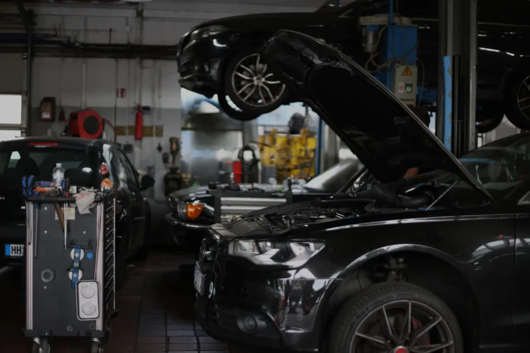 Car with its hood open in a repair shop, illustrating a lemon law Illinois repair claim